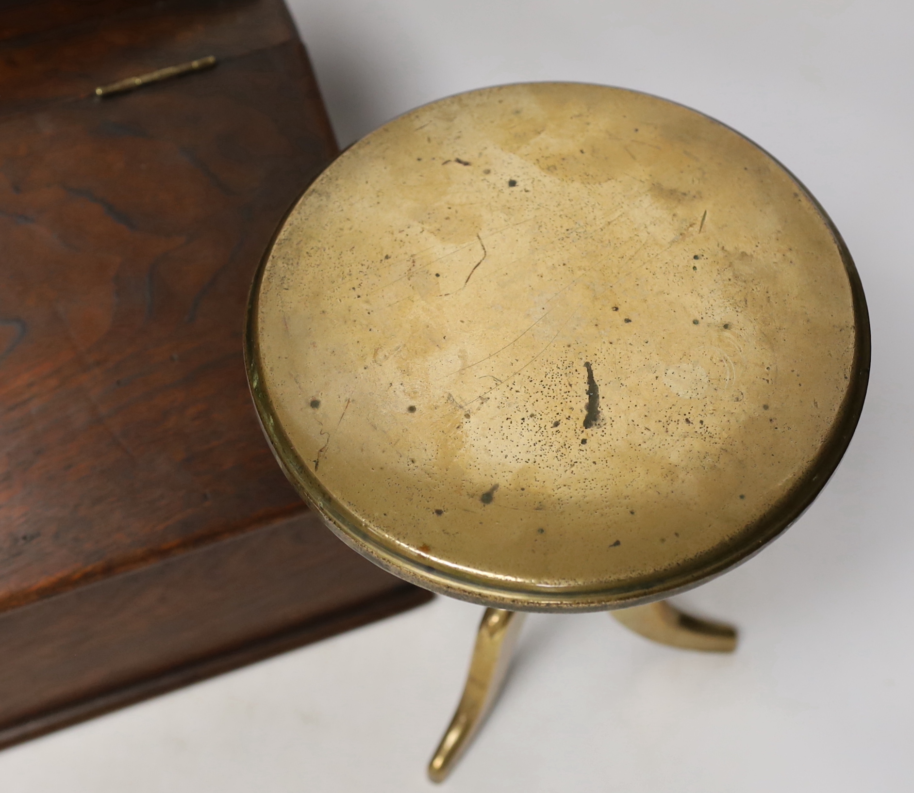 A Georgian brass trivet and a 19th century candle box, largest 27cm wide